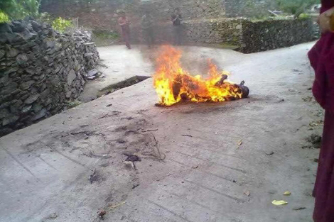 PHOTO: Tibetan monk Lobsang Lozin sets himself on fire to protest. | E.M.